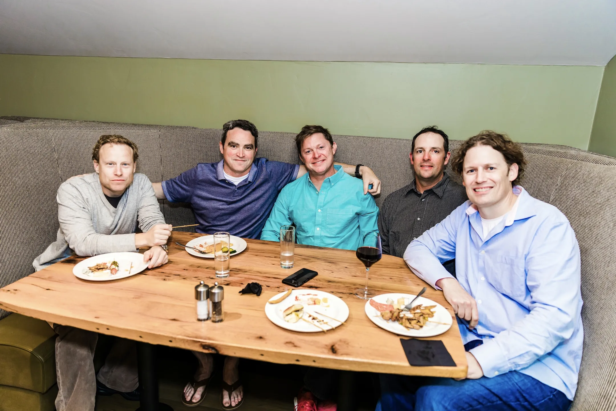 Friends gathered around a dinner table