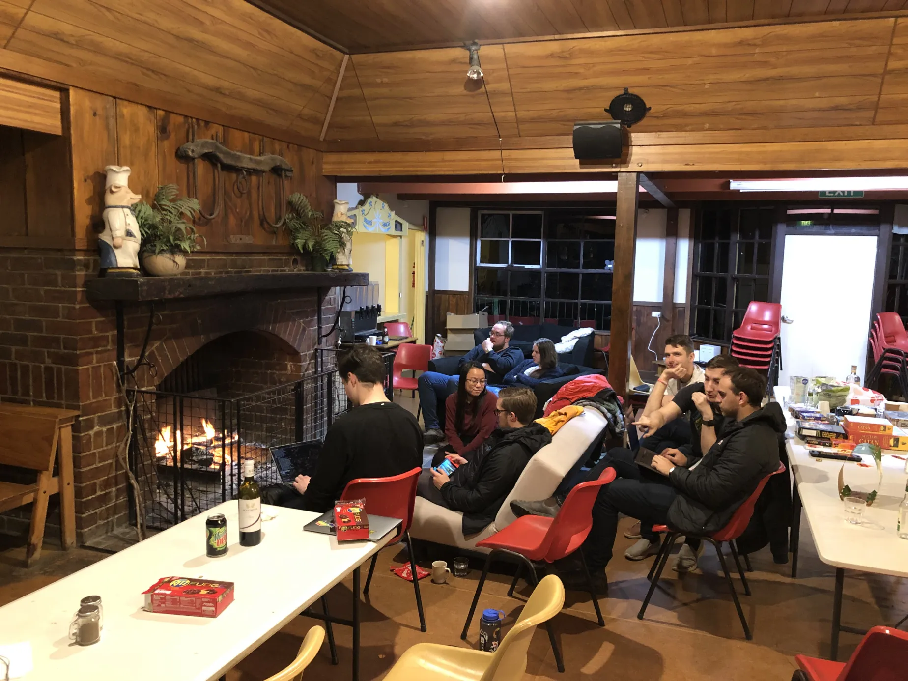 People gathered around a fireplace