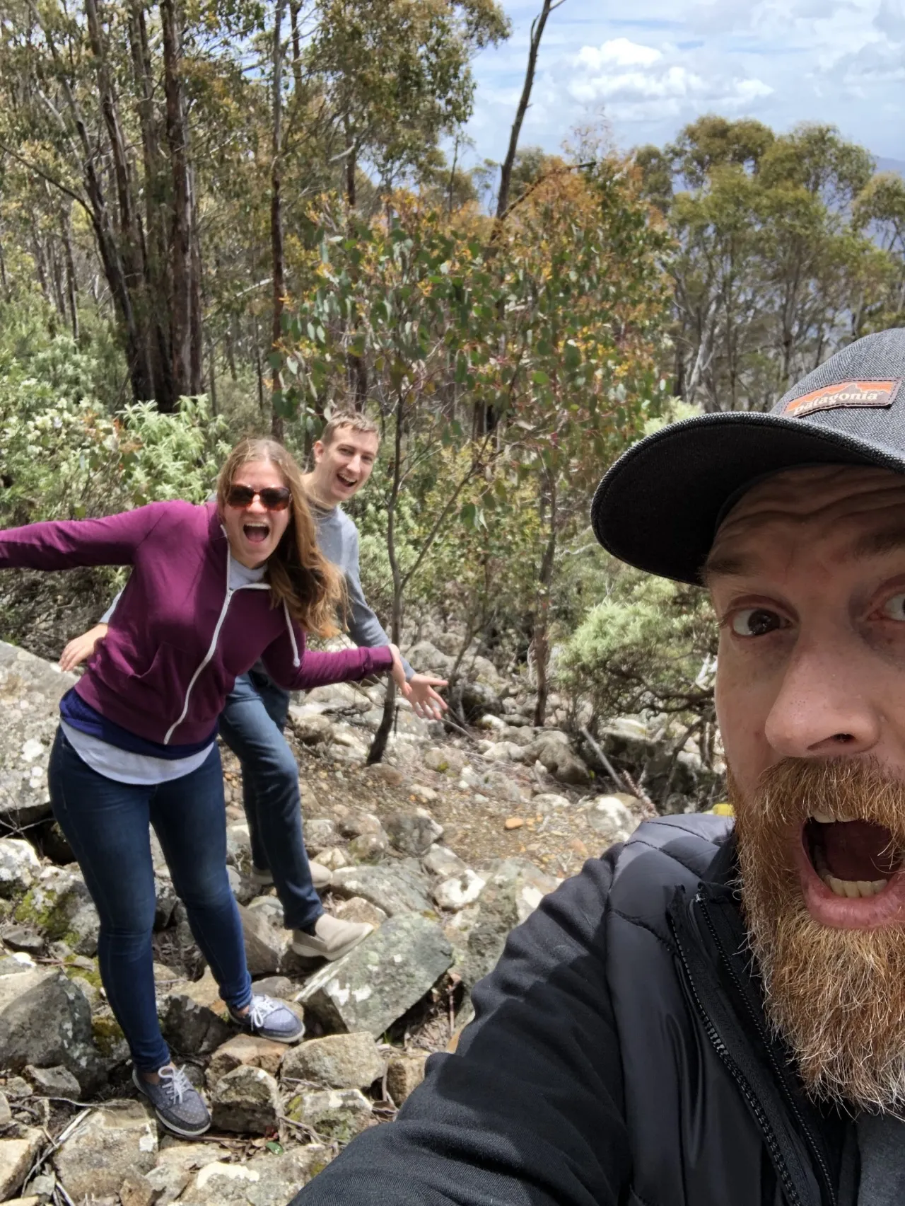 Three people hiking on a mountain