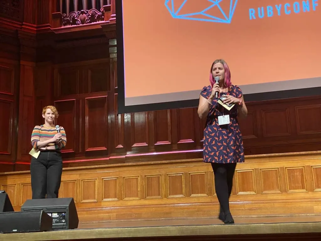 Two women hosting a conference