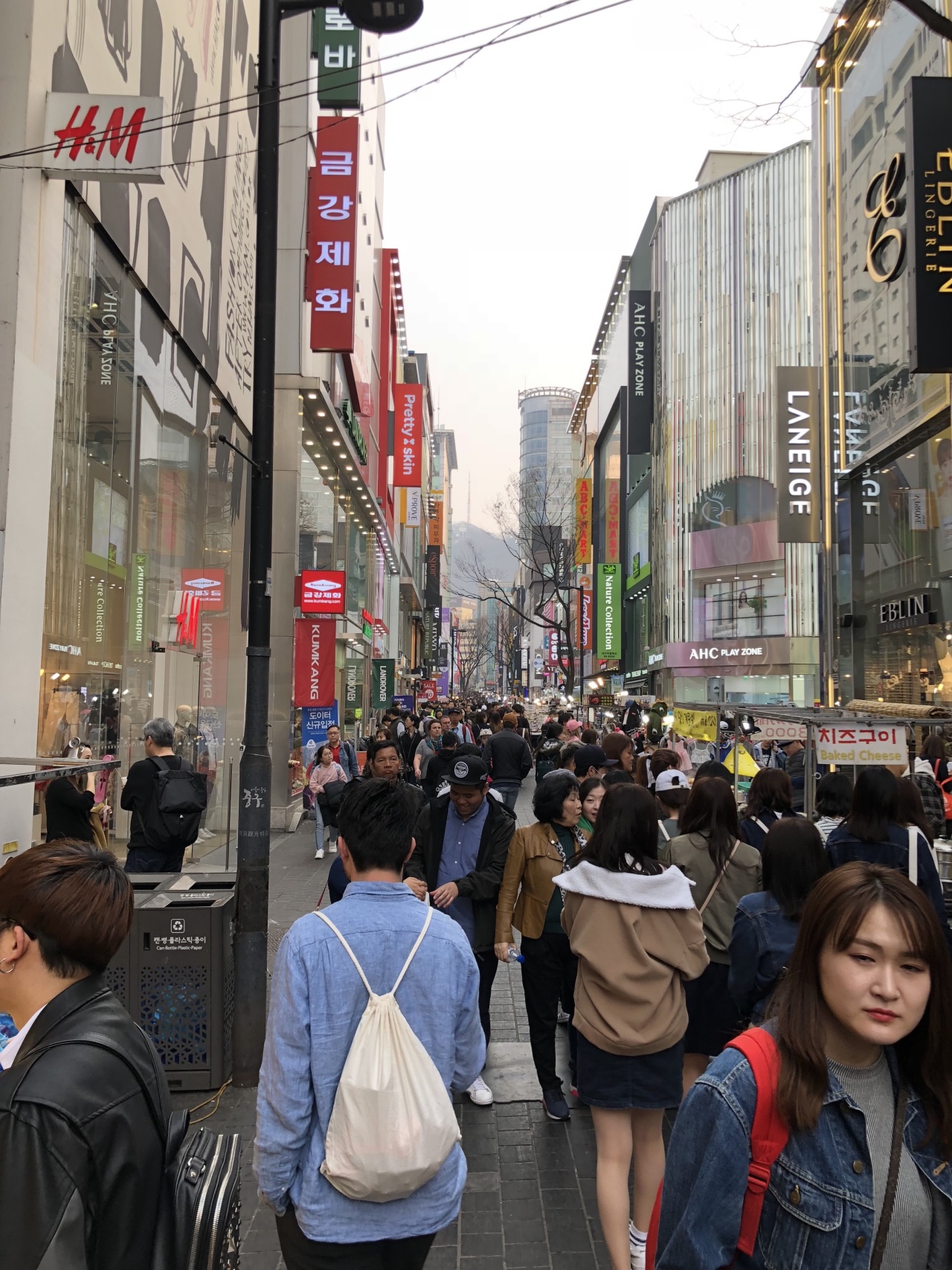 Many people in a busy outdoor shopping district