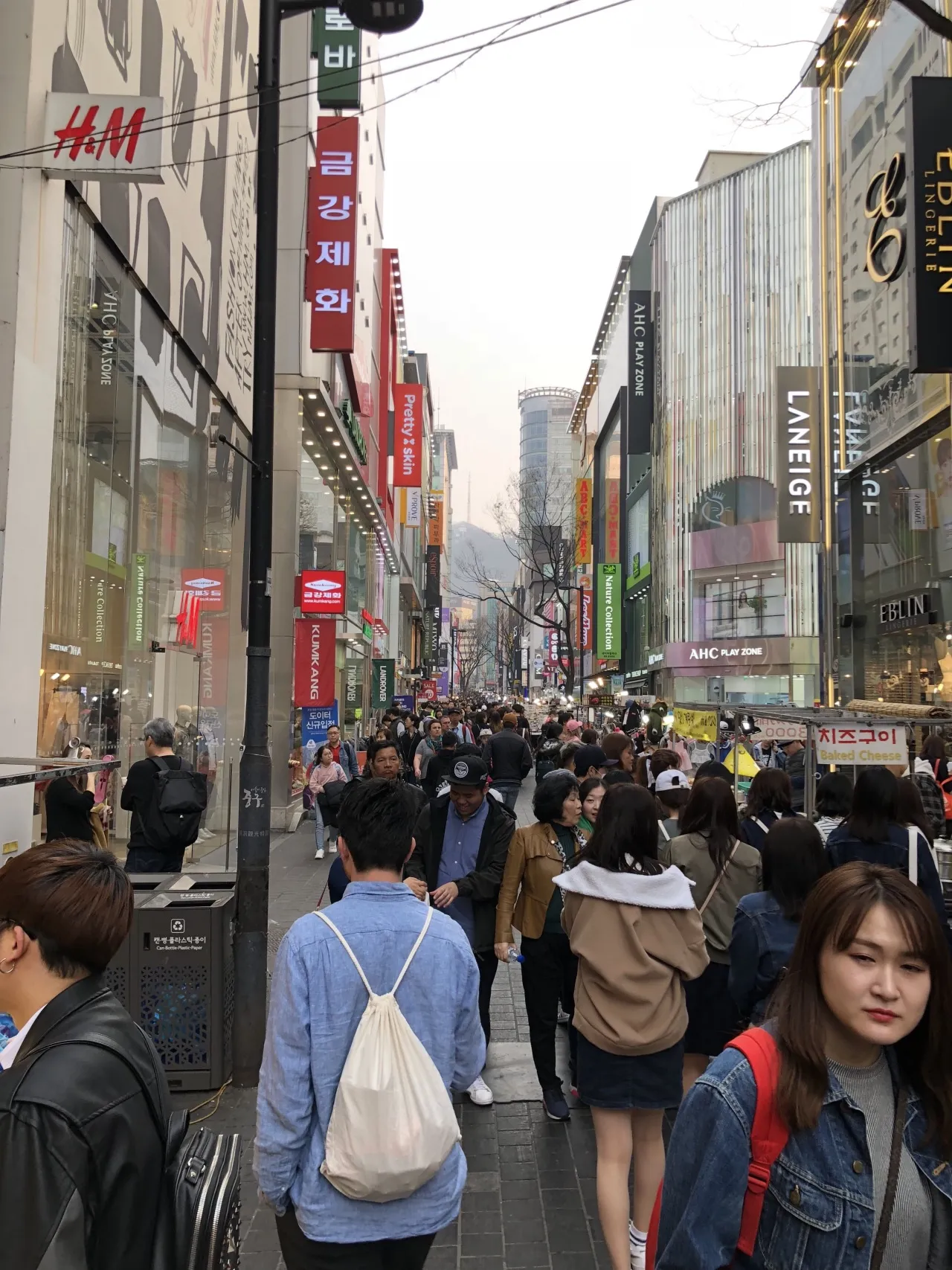 Many people in a busy outdoor shopping district