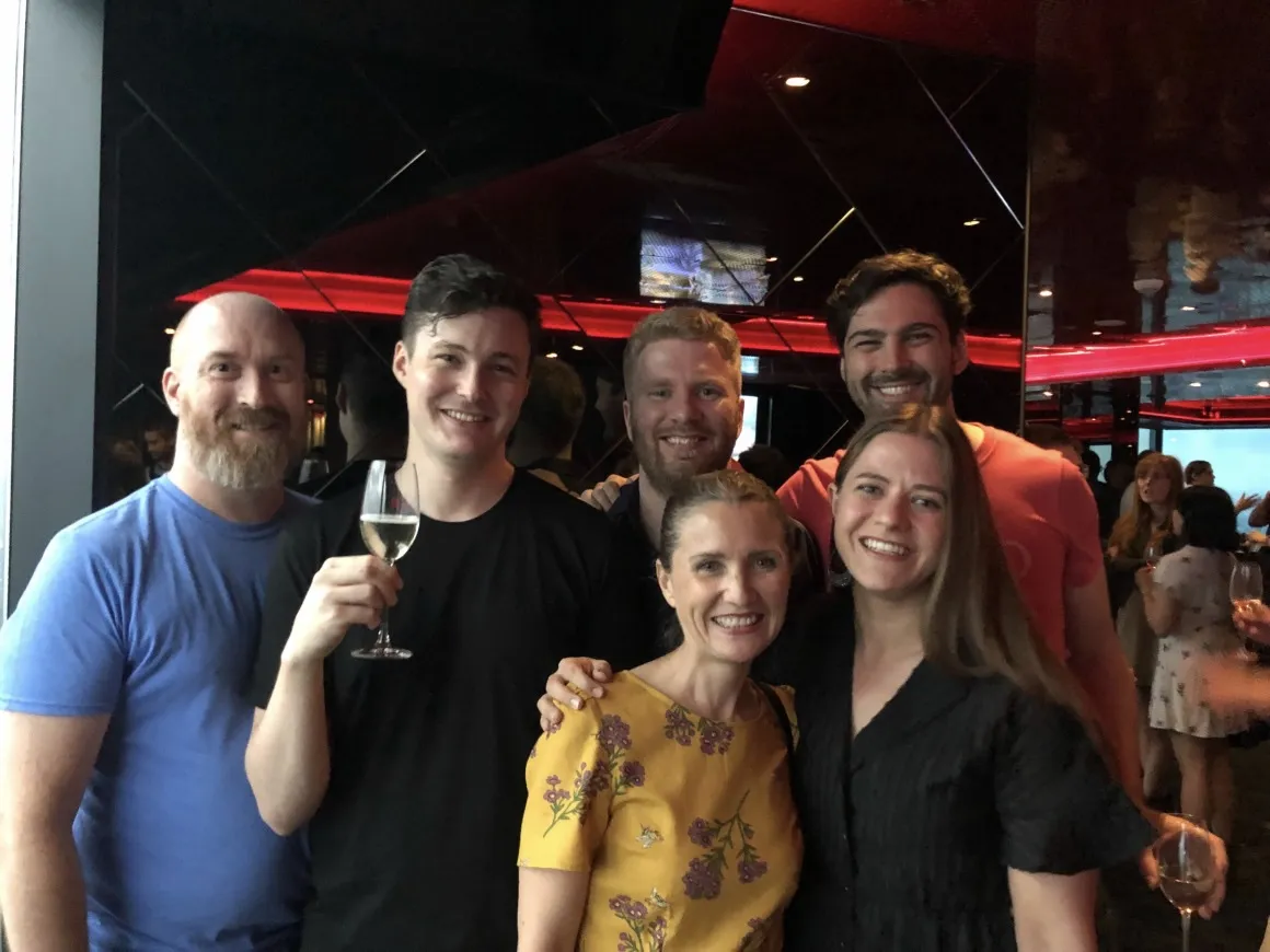 Six people posing together