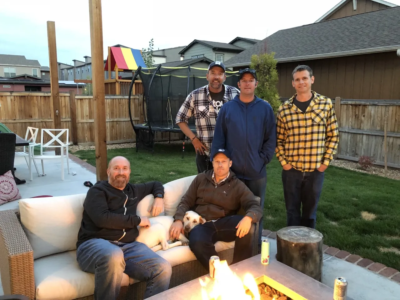 Five men in a backyard