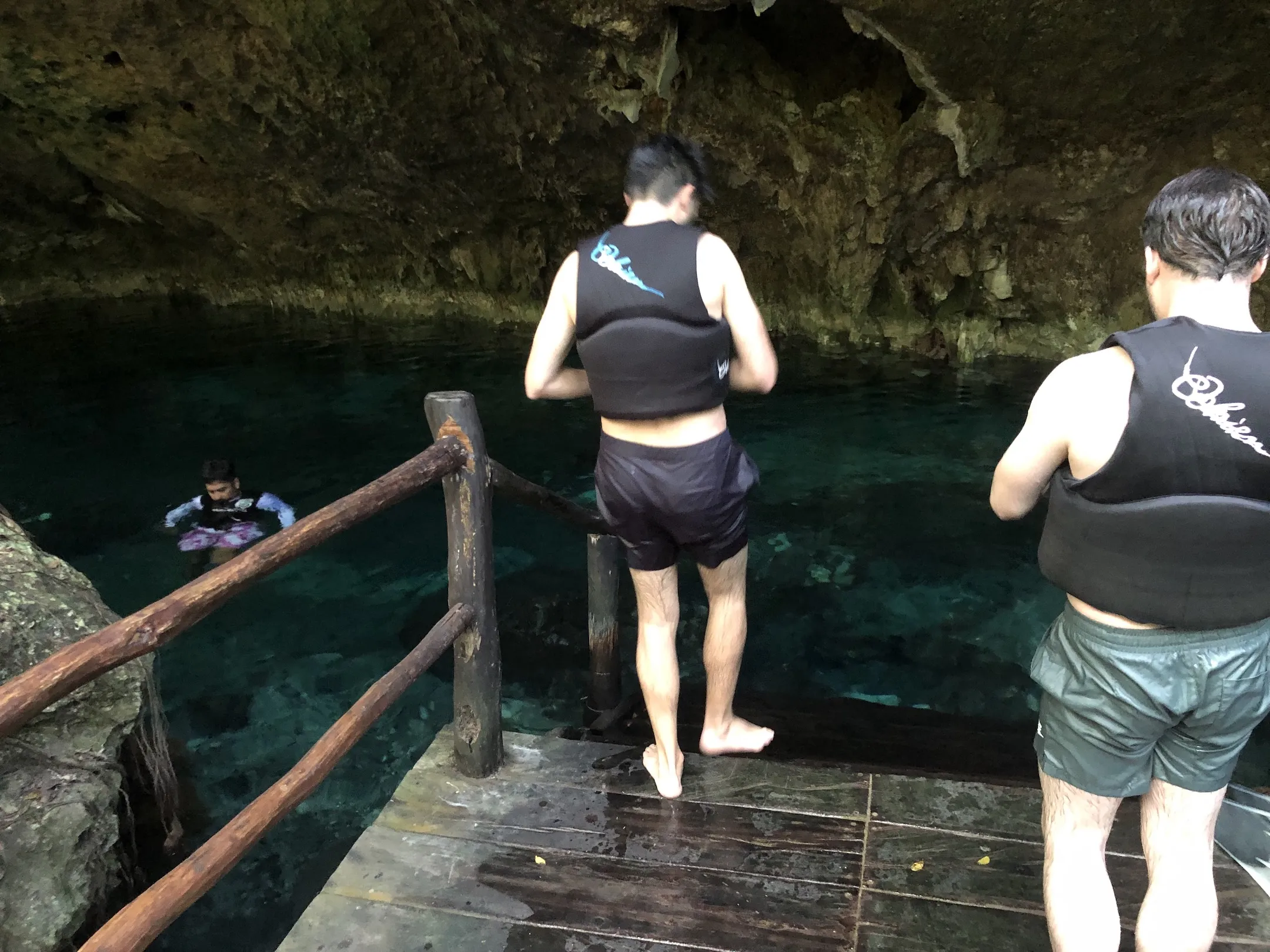 People swimming in a cenote