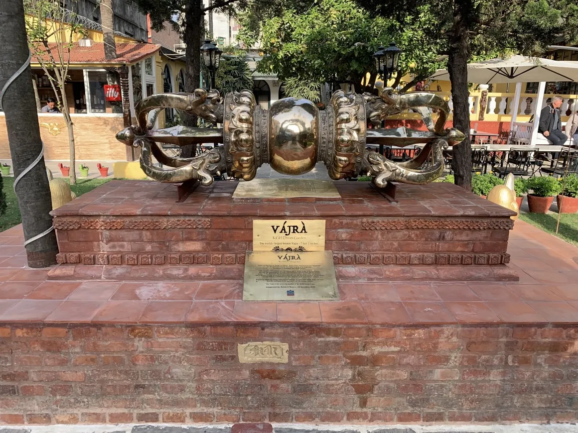 A decorative Buddhist symbol in brass